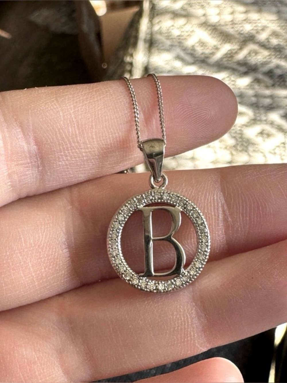 Letter B pendant featuring a circle of small faux diamonds